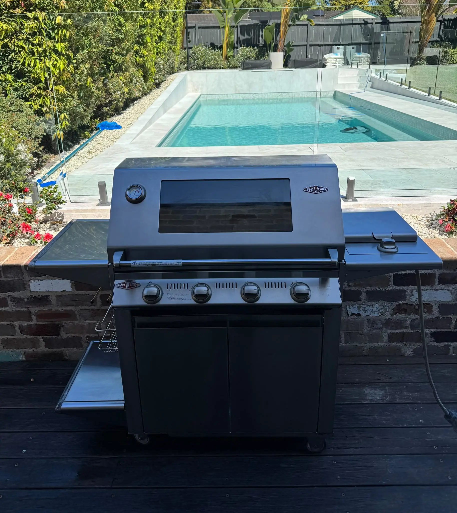 Front view of a BeefEater four-burner BBQ in Putney after cleaning and cosmetic restoration