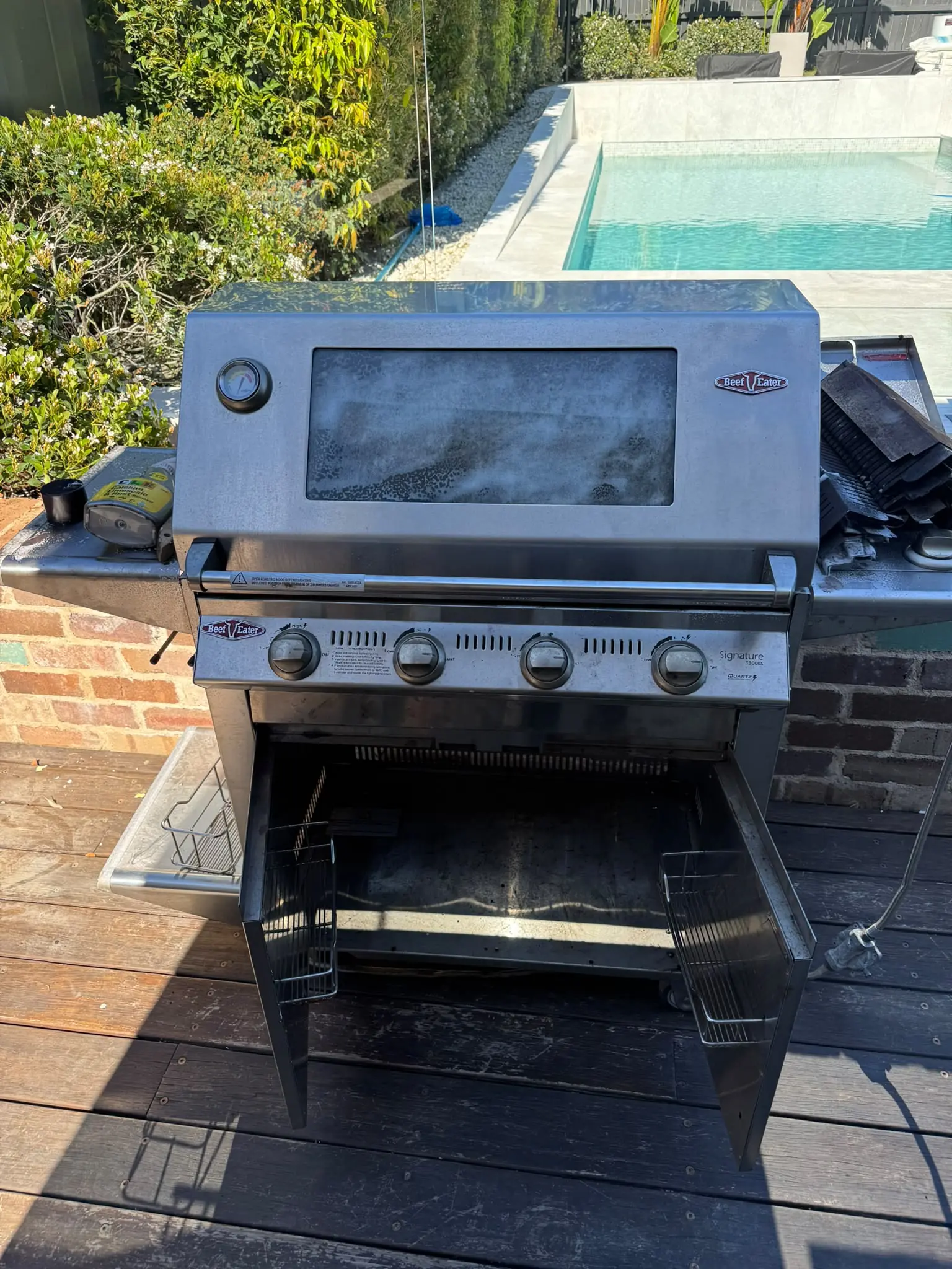 Front view of a BeefEater four-burner BBQ in Putney before cleaning and cosmetic restoration