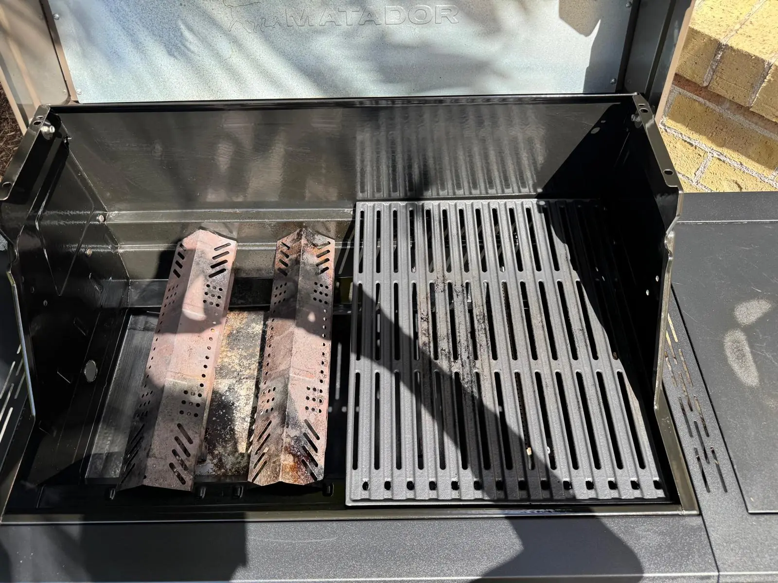 Matador Spark BBQ showing cleaned flame tamers, grill and hotplate components in Narraweena