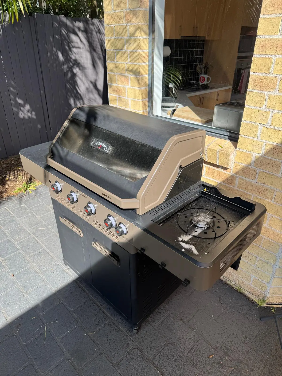 Front view of a Matador Spark four-burner trolley BBQ in Narraweena before cleaning