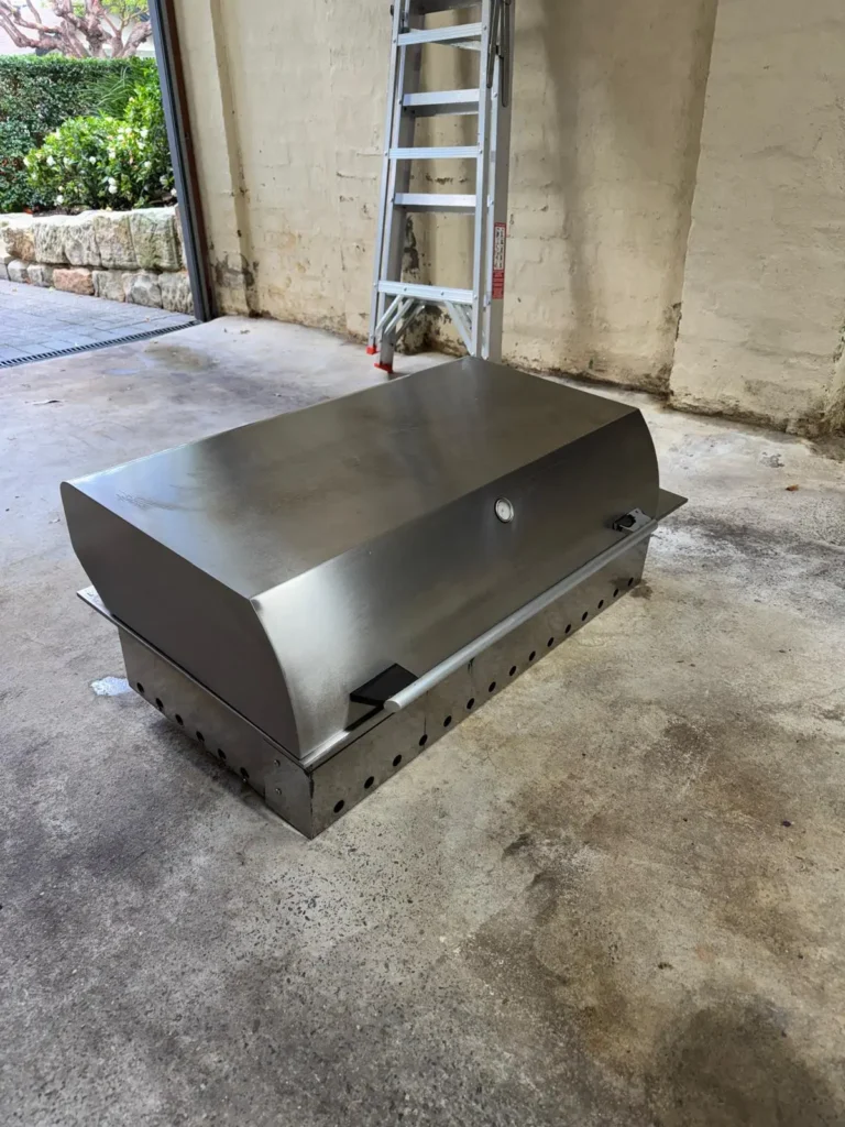Restored stainless-steel built-in BBQ detail in Sydney